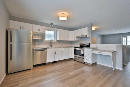 2123B 20A Avenue, Coaldale, AB - Indoor Photo Showing Kitchen With Double Sink