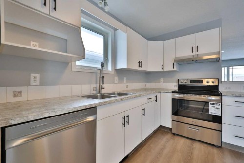 2123B 20A Avenue, Coaldale, AB - Indoor Photo Showing Kitchen With Double Sink