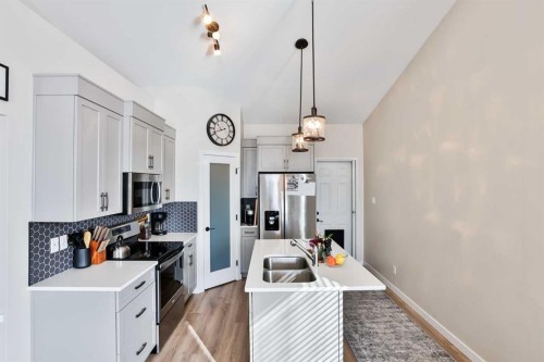 918 Greywolf Run North, Lethbridge, AB - Indoor Photo Showing Kitchen With Double Sink With Upgraded Kitchen