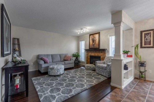 420 Silkstone Crescent West, Lethbridge, AB - Indoor Photo Showing Living Room With Fireplace