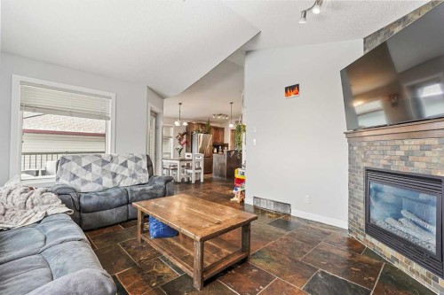 352 Tartan Circle West, Lethbridge, AB - Indoor Photo Showing Living Room With Fireplace