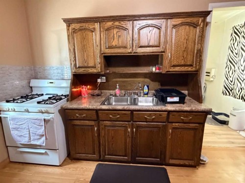 6119 53 Street, Taber, AB - Indoor Photo Showing Kitchen With Double Sink