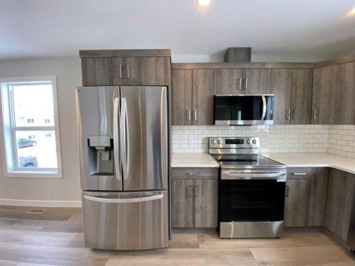 4229 57 Street, Taber, AB - Indoor Photo Showing Kitchen With Stainless Steel Kitchen