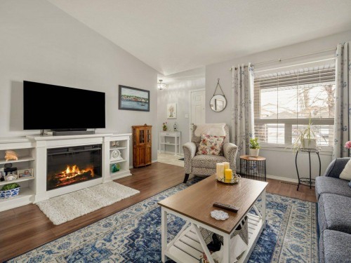 61 Rivercrest Court West, Lethbridge, AB - Indoor Photo Showing Living Room With Fireplace