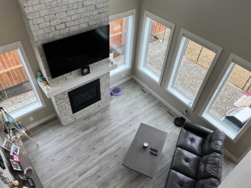 642 Moonlight Lane West, Lethbridge, AB - Indoor Photo Showing Living Room With Fireplace