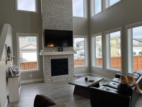 642 Moonlight Lane West, Lethbridge, AB - Indoor Photo Showing Living Room With Fireplace