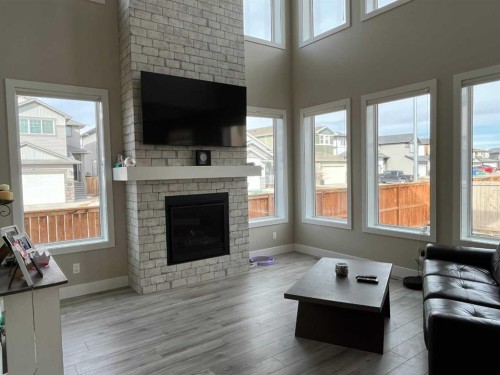 642 Moonlight Lane West, Lethbridge, AB - Indoor Photo Showing Living Room With Fireplace