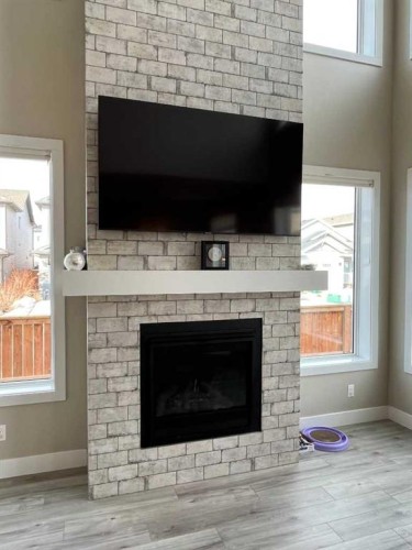 642 Moonlight Lane West, Lethbridge, AB - Indoor Photo Showing Living Room With Fireplace