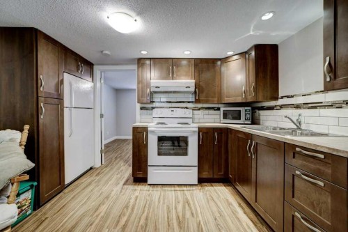 1112 17 Street South, Lethbridge, AB - Indoor Photo Showing Kitchen With Double Sink