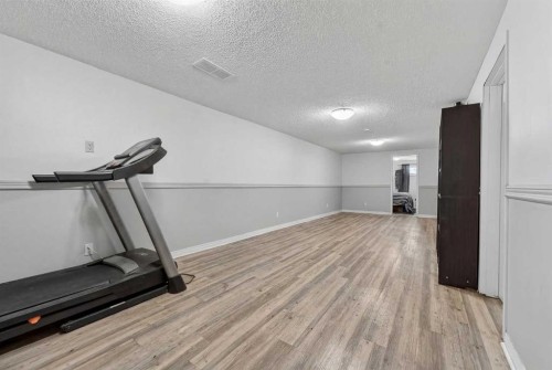 7705 24 Avenue, Coleman, AB - Indoor Photo Showing Gym Room