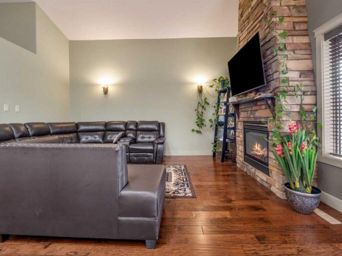128 Sixmile Common South, Lethbridge, AB - Indoor Photo Showing Living Room With Fireplace