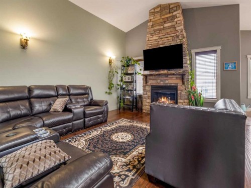 128 Sixmile Common South, Lethbridge, AB - Indoor Photo Showing Living Room With Fireplace