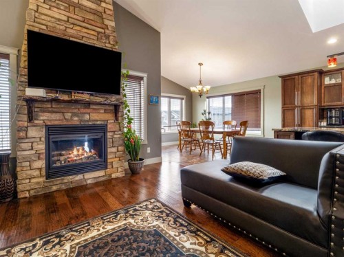128 Sixmile Common South, Lethbridge, AB - Indoor Photo Showing Living Room With Fireplace