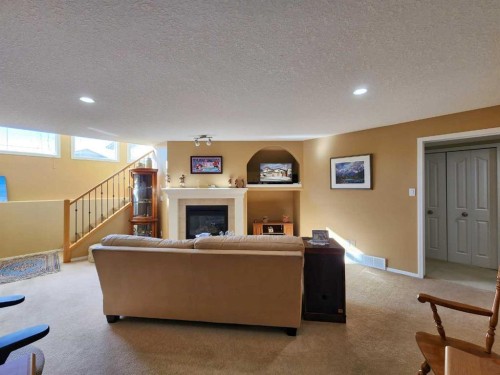 52 Squamish Crescent West, Lethbridge, AB - Indoor With Fireplace