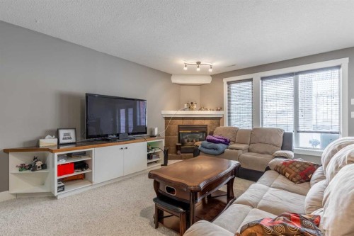 4-369 Canyon Boulevard West, Lethbridge, AB - Indoor Photo Showing Living Room With Fireplace
