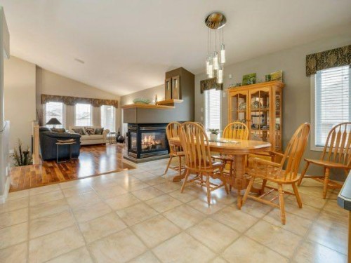 76 Grand River Boulevard West, Lethbridge, AB - Indoor Photo Showing Dining Room With Fireplace