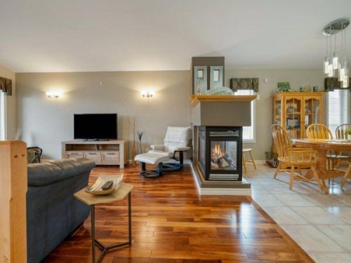 76 Grand River Boulevard West, Lethbridge, AB - Indoor Photo Showing Living Room With Fireplace