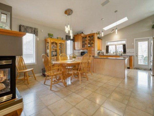 76 Grand River Boulevard West, Lethbridge, AB - Indoor Photo Showing Dining Room With Fireplace