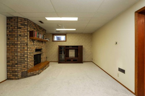 4803 59 Avenue, Taber, AB - Indoor With Fireplace