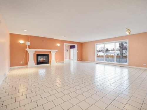 2123 10 Avenue South, Lethbridge, AB - Indoor Photo Showing Living Room With Fireplace