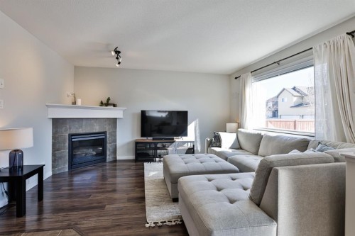 437 Twinriver Road West, Lethbridge, AB - Indoor Photo Showing Living Room With Fireplace