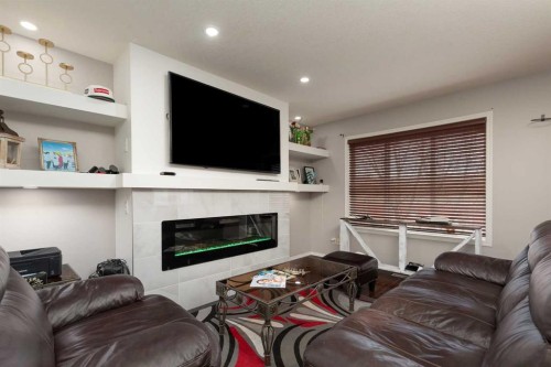 10-545 Highlands Boulevard West, Lethbridge, AB - Indoor Photo Showing Living Room With Fireplace