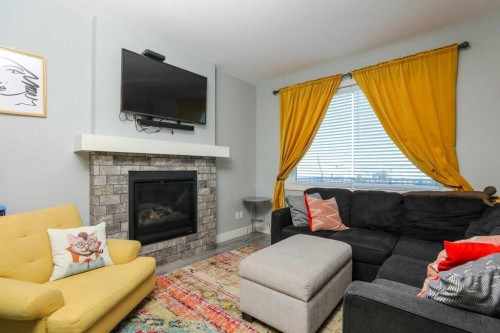 502 Bluebell Lane West, Lethbridge, AB - Indoor Photo Showing Living Room With Fireplace
