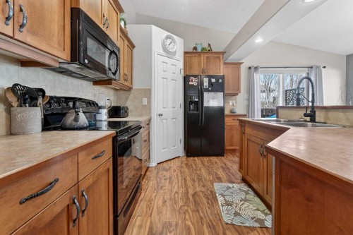 210 Firelight Crescent West, Lethbridge, AB - Indoor Photo Showing Kitchen With Double Sink