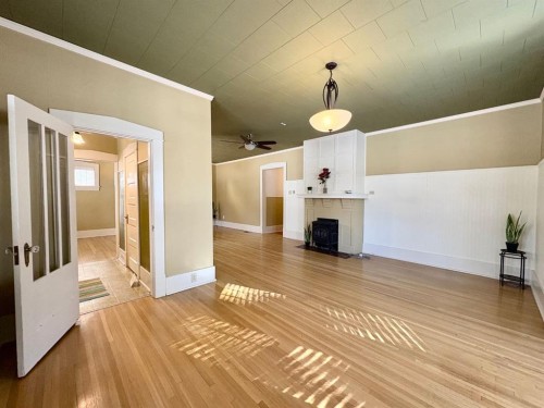 1407 4 Avenue South, Lethbridge, AB - Indoor Photo Showing Other Room With Fireplace