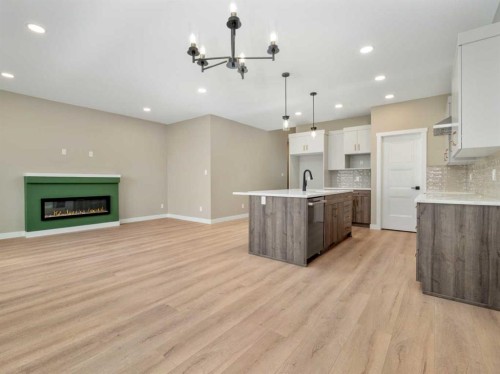 409 Rivergrove Chase West, Lethbridge, AB - Indoor Photo Showing Other Room With Fireplace