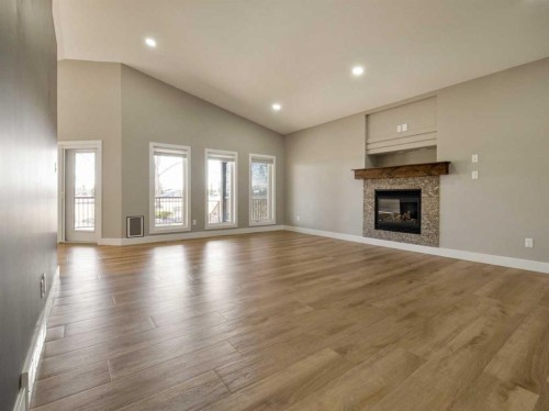 147 Westgate Drive, Coaldale, AB - Indoor Photo Showing Living Room With Fireplace