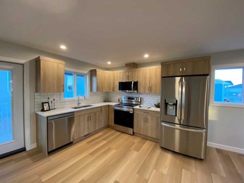 4202 57 Street, Taber, AB - Indoor Photo Showing Kitchen With Stainless Steel Kitchen With Double Sink