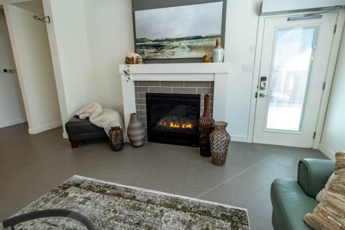 108 Gateway Mews South, Lethbridge, AB - Indoor Photo Showing Living Room With Fireplace