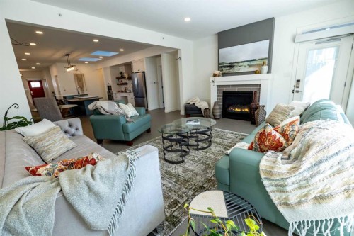 108 Gateway Mews South, Lethbridge, AB - Indoor Photo Showing Living Room With Fireplace