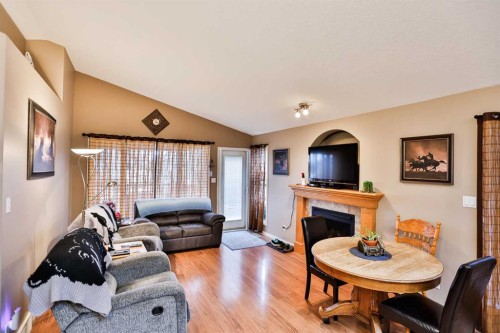 408 Thyrza Burkitt Link North, Lethbridge, AB - Indoor Photo Showing Living Room With Fireplace