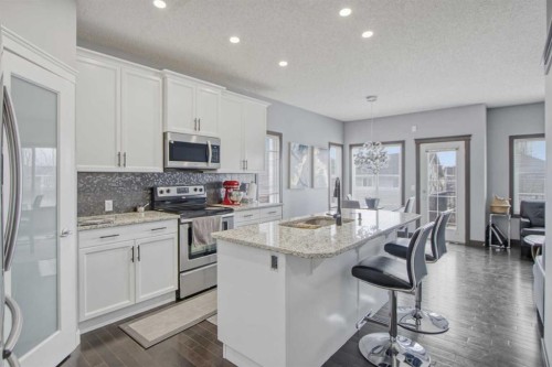 13 Evanscove Manor Nw, Calgary, AB - Indoor Photo Showing Kitchen With Double Sink With Upgraded Kitchen