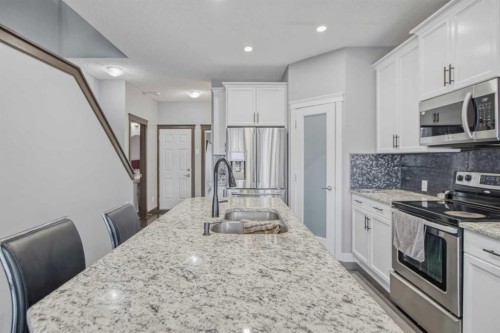 13 Evanscove Manor Nw, Calgary, AB - Indoor Photo Showing Kitchen With Double Sink With Upgraded Kitchen