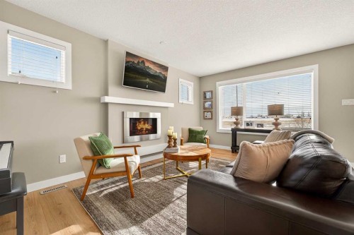 148 Cabot Landing West, Lethbridge, AB - Indoor Photo Showing Living Room With Fireplace