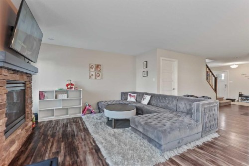 493 Devonia Way West, Lethbridge, AB - Indoor Photo Showing Living Room With Fireplace