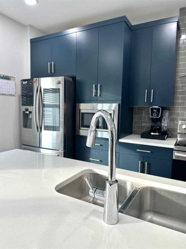 1366 Pacific Circle West, Lethbridge, AB - Indoor Photo Showing Kitchen With Double Sink