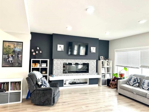 1366 Pacific Circle West, Lethbridge, AB - Indoor Photo Showing Living Room With Fireplace