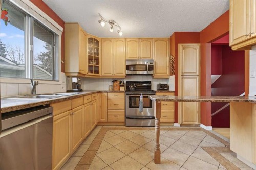 76 Brookpark Place Sw, Calgary, AB - Indoor Photo Showing Kitchen With Double Sink
