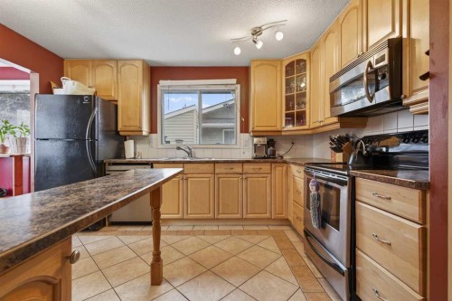 76 Brookpark Place Sw, Calgary, AB - Indoor Photo Showing Kitchen With Double Sink