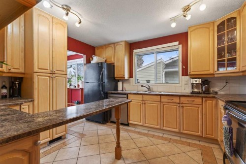 76 Brookpark Place Sw, Calgary, AB - Indoor Photo Showing Kitchen With Double Sink