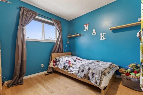 76 Brookpark Place Sw, Calgary, AB - Indoor Photo Showing Bedroom