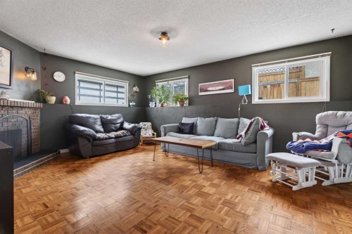 76 Brookpark Place Sw, Calgary, AB - Indoor Photo Showing Living Room With Fireplace