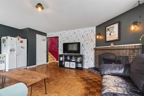 76 Brookpark Place Sw, Calgary, AB - Indoor Photo Showing Living Room With Fireplace