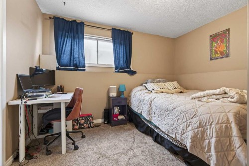 76 Brookpark Place Sw, Calgary, AB - Indoor Photo Showing Bedroom