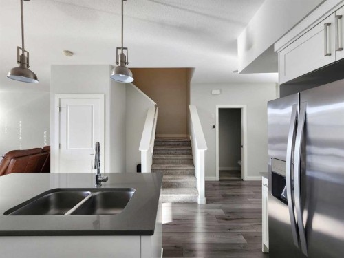 2-69 Aquitania Circle West, Lethbridge, AB - Indoor Photo Showing Kitchen With Double Sink