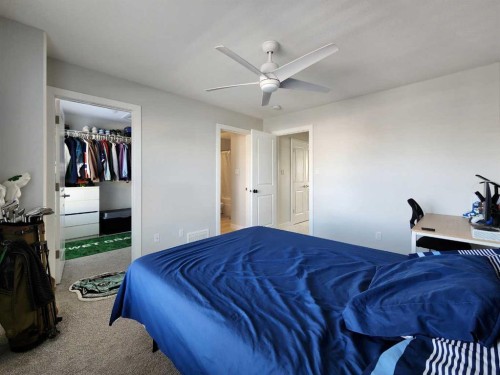 2-69 Aquitania Circle West, Lethbridge, AB - Indoor Photo Showing Bedroom